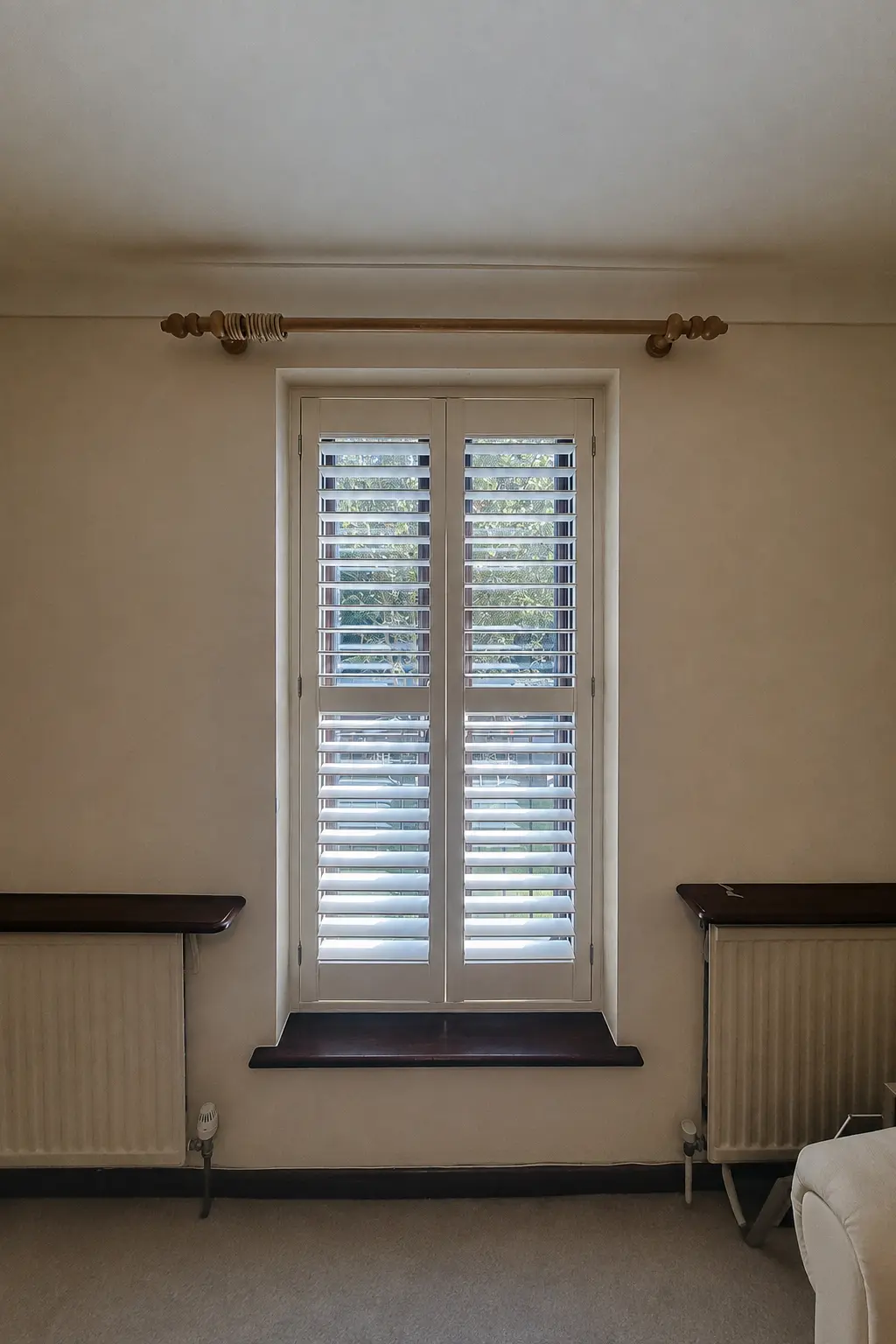 Full-height plantation shutters in a narrow window