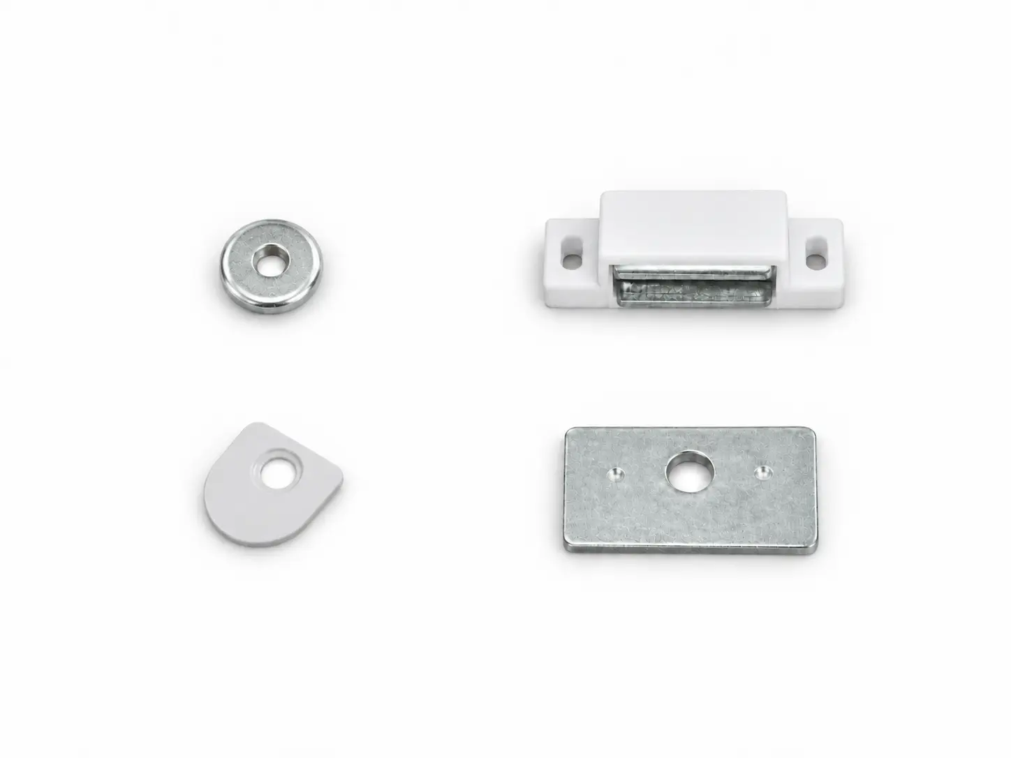 White magnetic shutter catch beside round and rectangular metal plates
